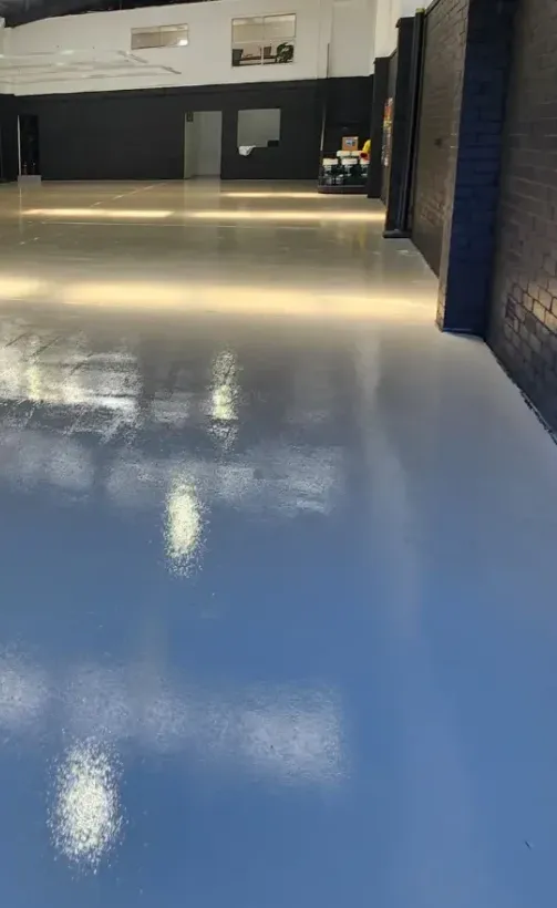 Concrete Masters v2 Worn distribution center concrete floor before epoxy coating