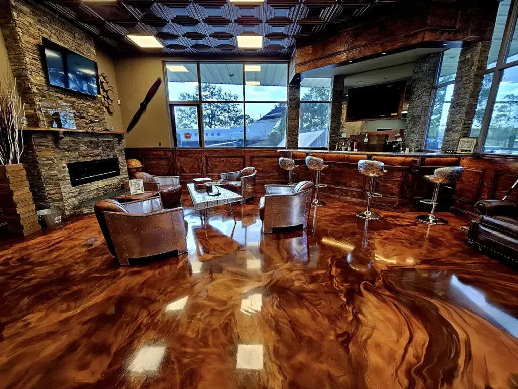 Concrete Masters v2 Metallic epoxy floor with copper and bronze color shift effect in commercial lobby in Smyrna, Georgia