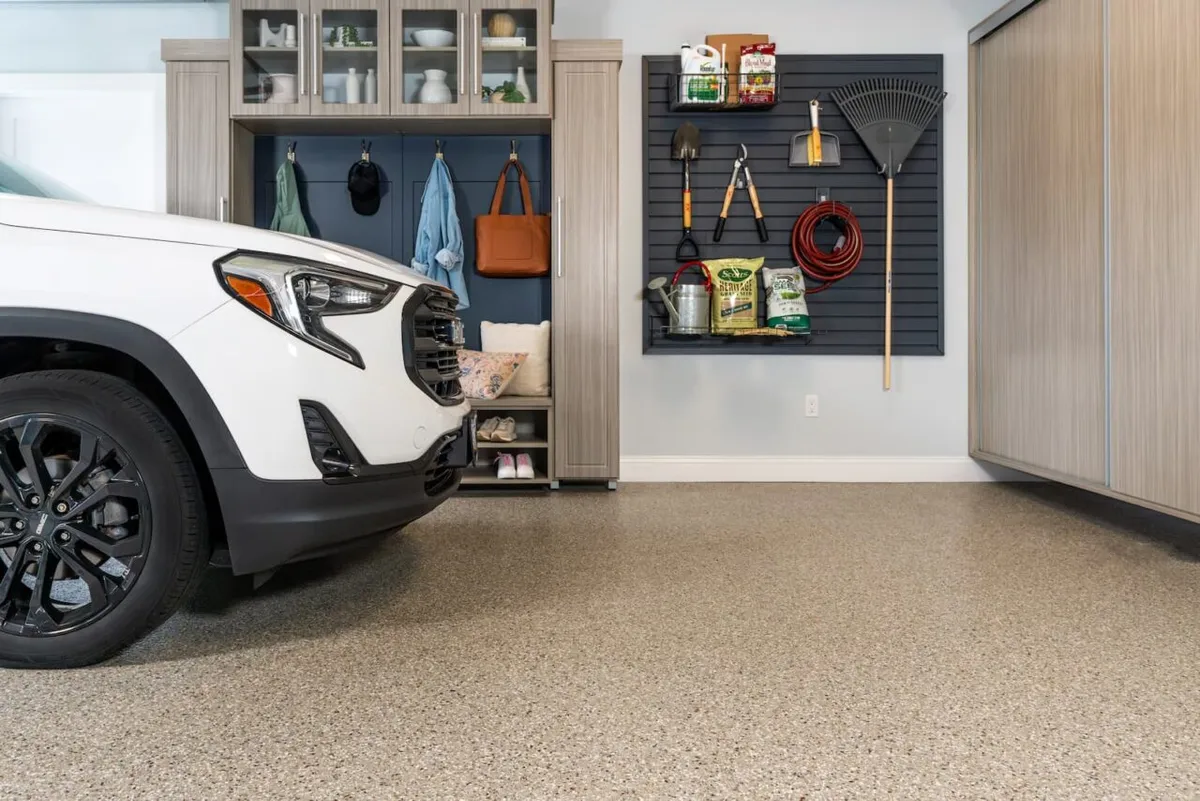 Concrete Masters v2 Quartz broadcast epoxy floor in automotive service center with slip-resistant texture in Alpharetta, Georgia