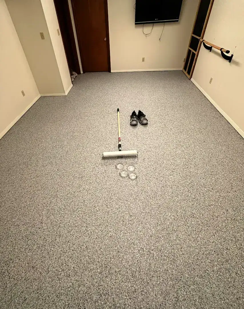 Concrete Masters v2 Finished gray flake garage floor coating in a residential garage